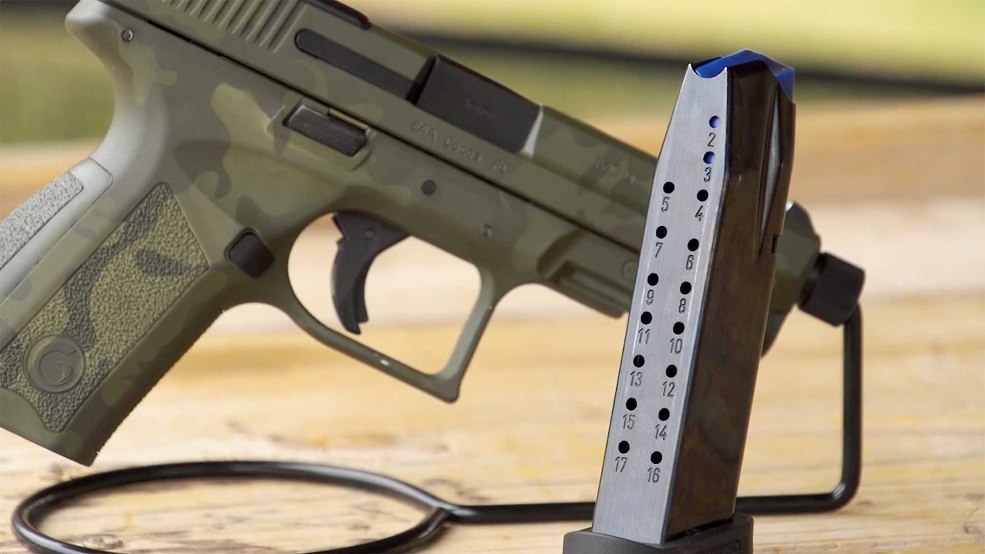 An empty 17-round magazine next to an EAA Girsan MC9 Disruptor pistol.