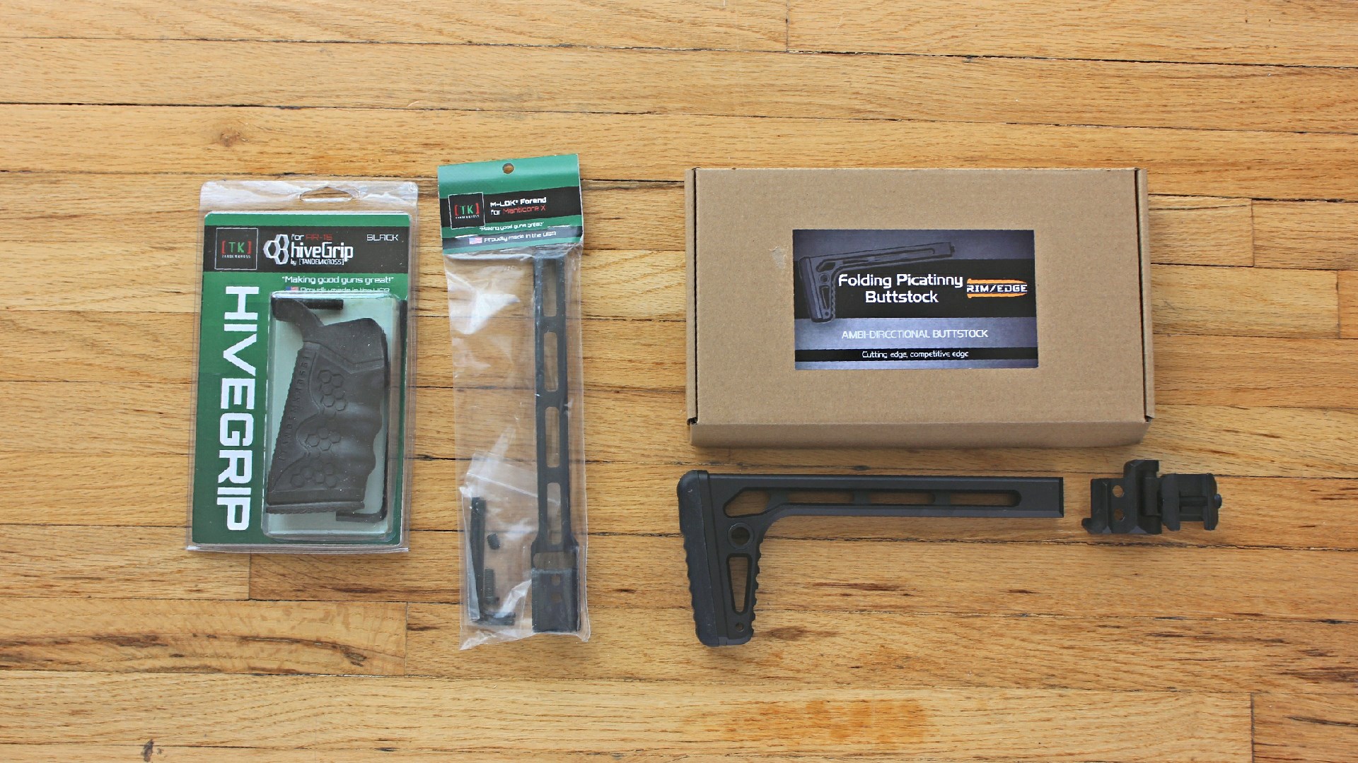 Tandemkross pro bundle parts set including grip stock box packages on wood floor