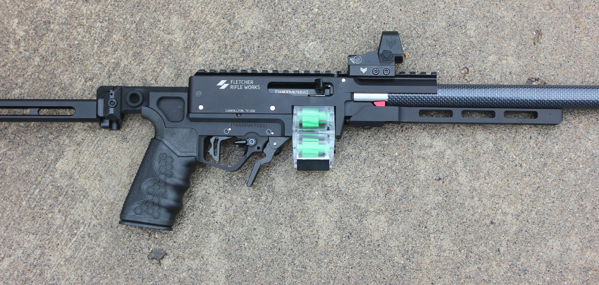 Custom rifle build right-side view receiver magazine on concrete