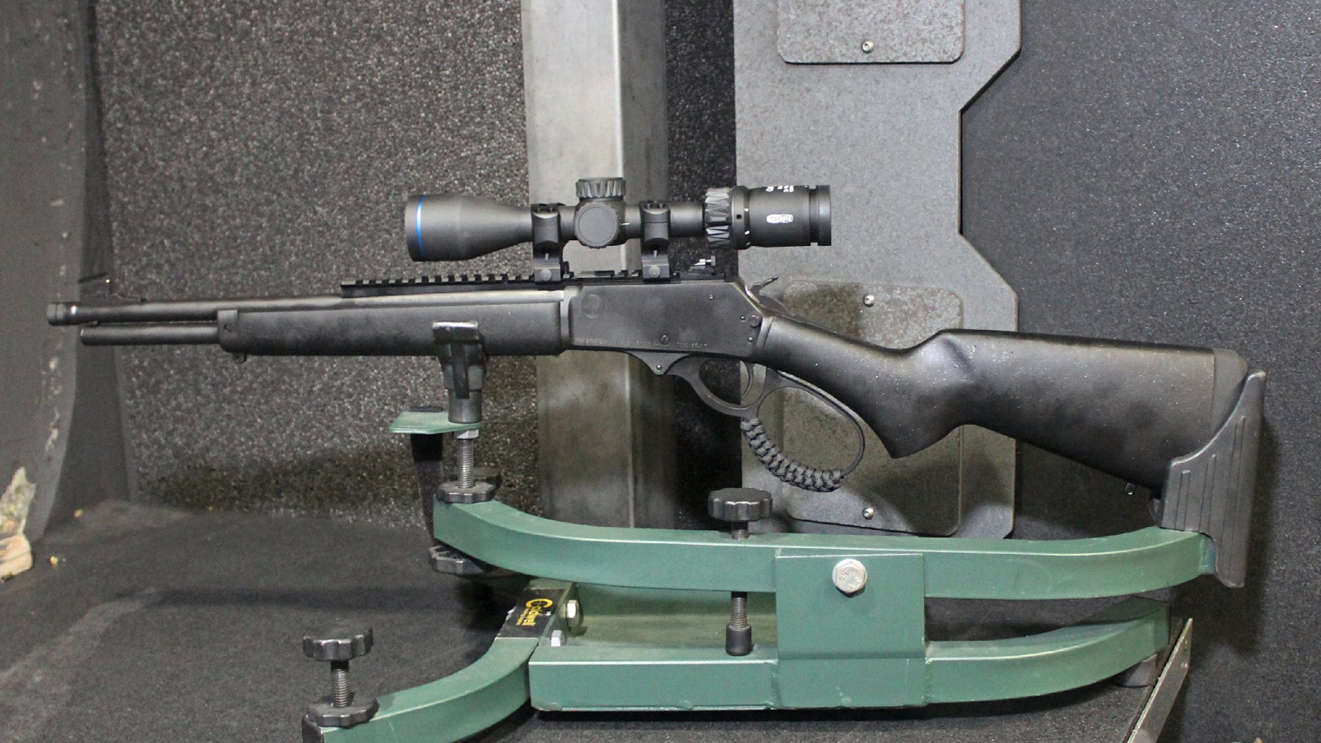 Rossi R95 Triple Black lever-action rifle left-side view in rest at shooting range