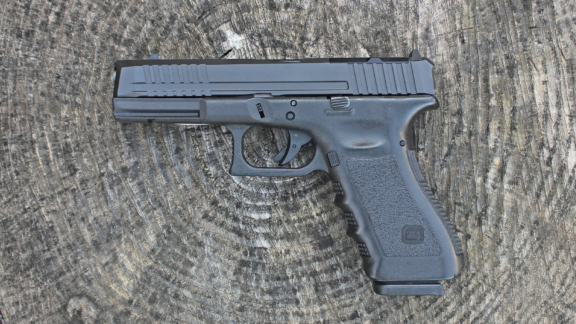 Custom glock pistol left-side view black gun