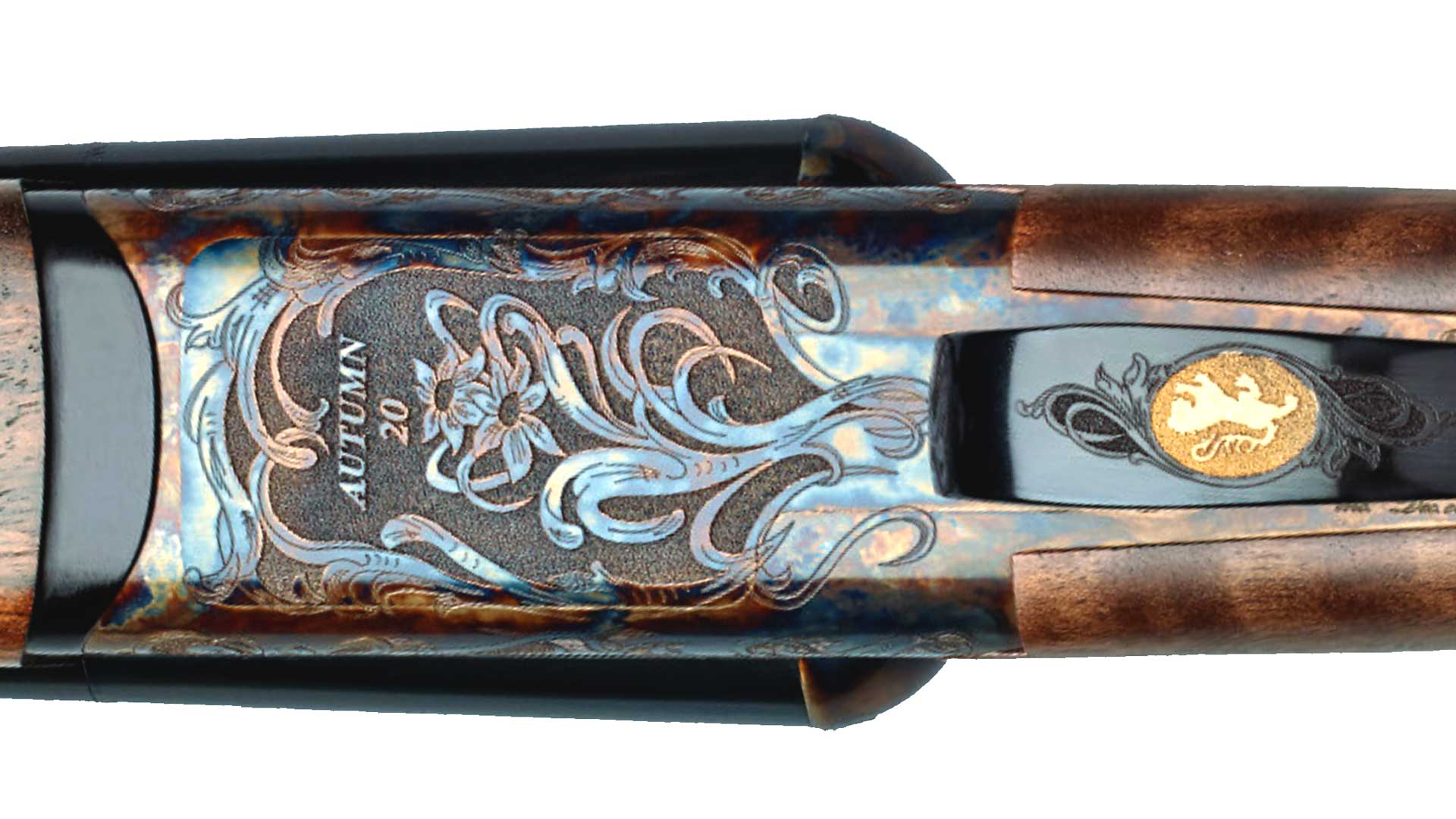 metal engraving gold emblem scrolls flowers gun receiver shotgun