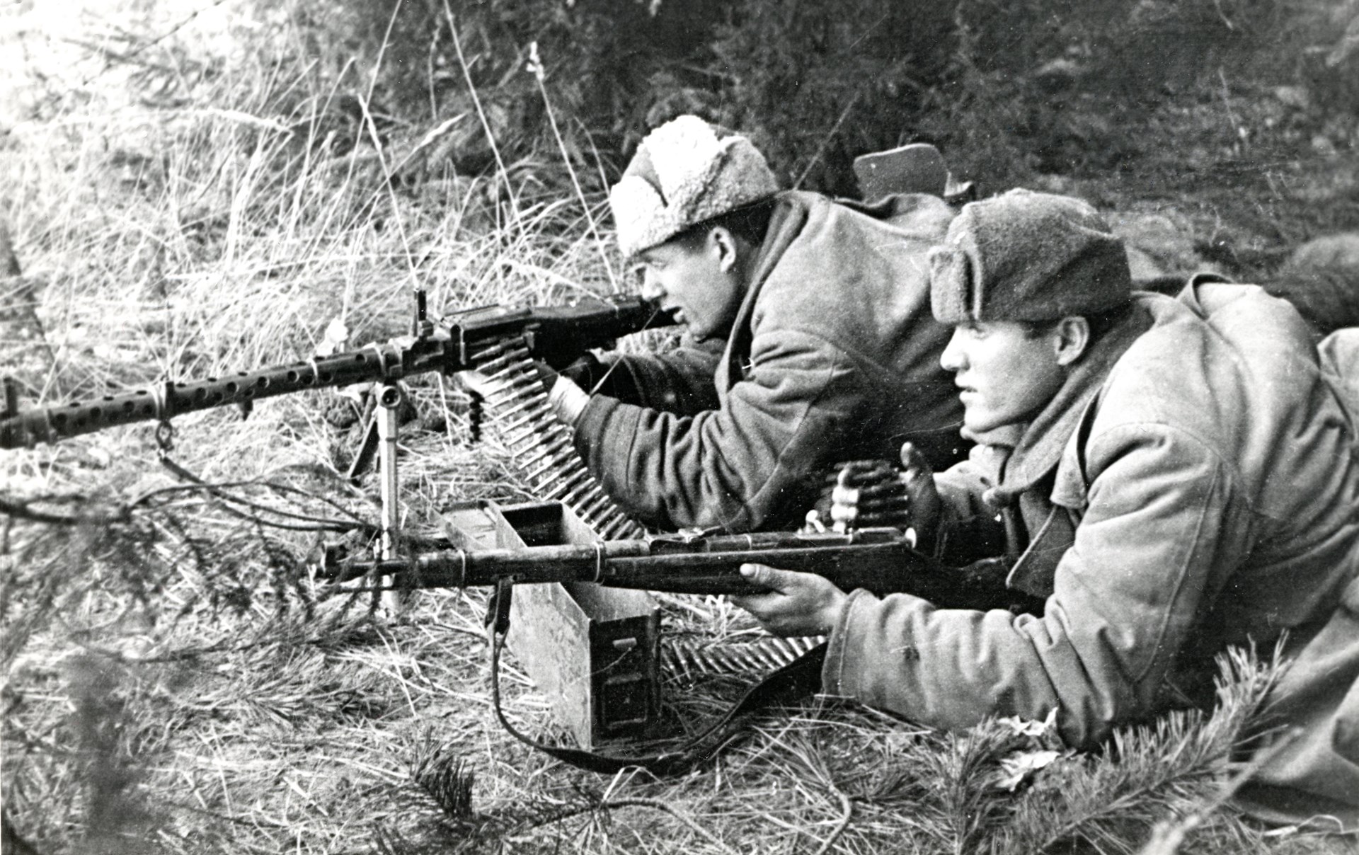 Captured firearms played an important role. Shown here, a German MG34 supports a partisan attack. The man alongside has a Mosin-Nagant Model 38 carbine. Author's collection