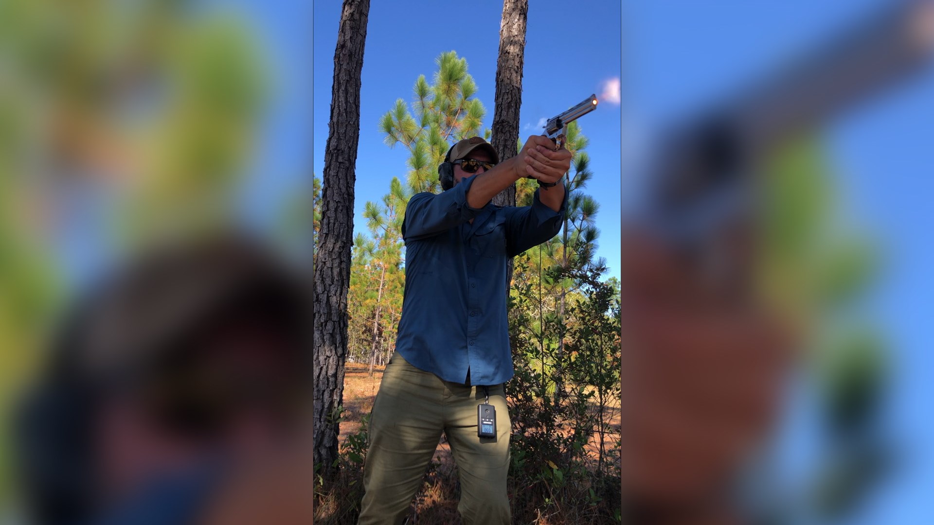 Author Justin Dyal outdoors shooting colt python revolver trees blue sky image overlay blurry background