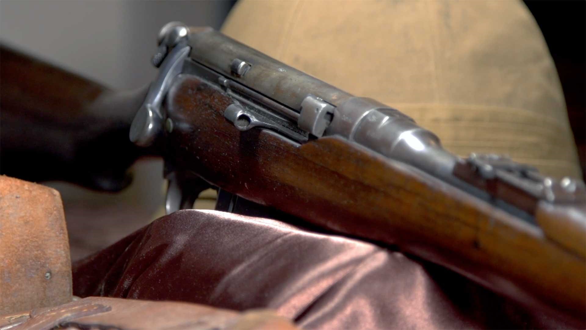 Right side of the Lee-Enfield carbine, showing the bolt handle and magazine cut-off.