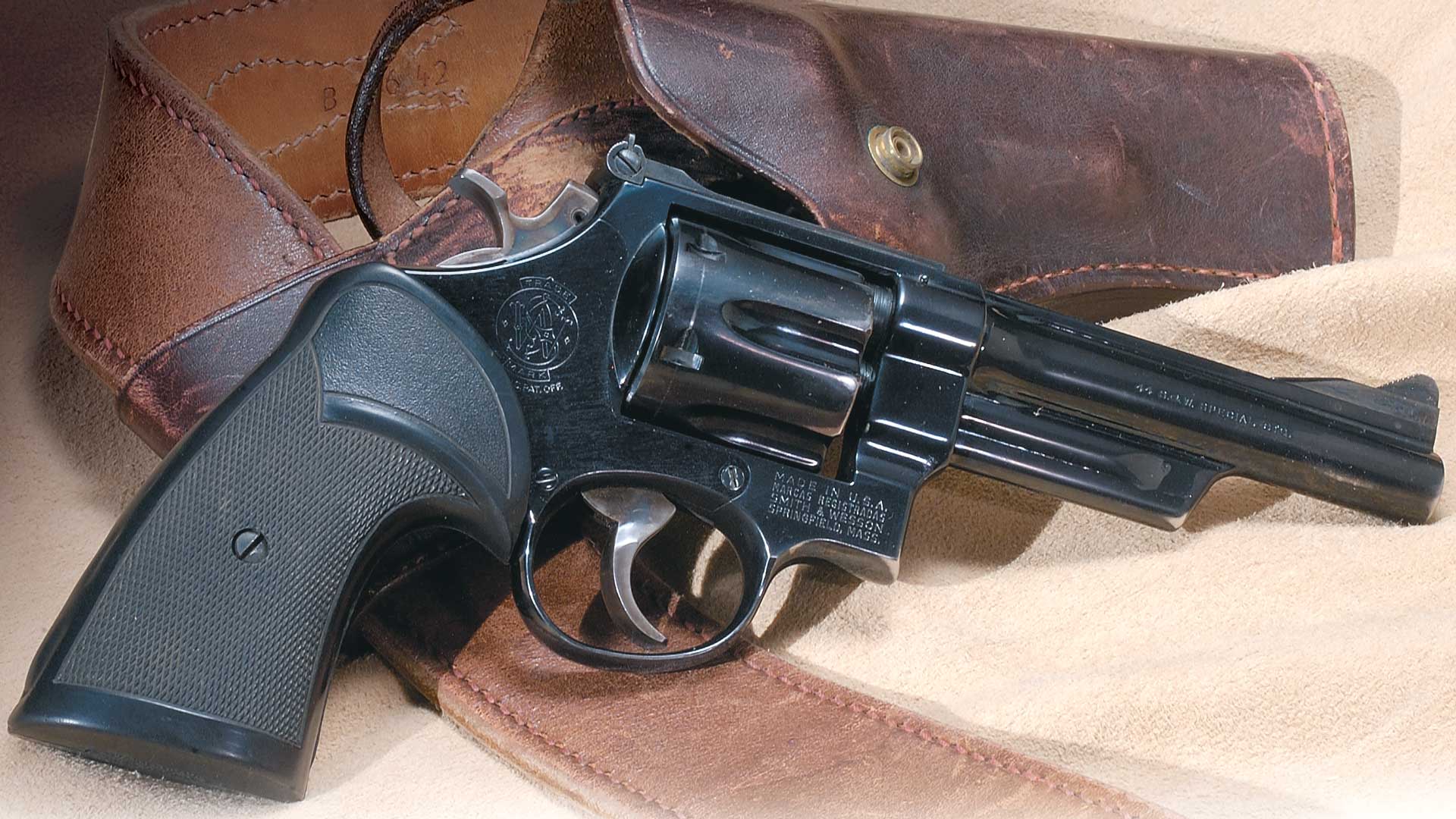 dark revolver metal blued steel pistol gun leather holster