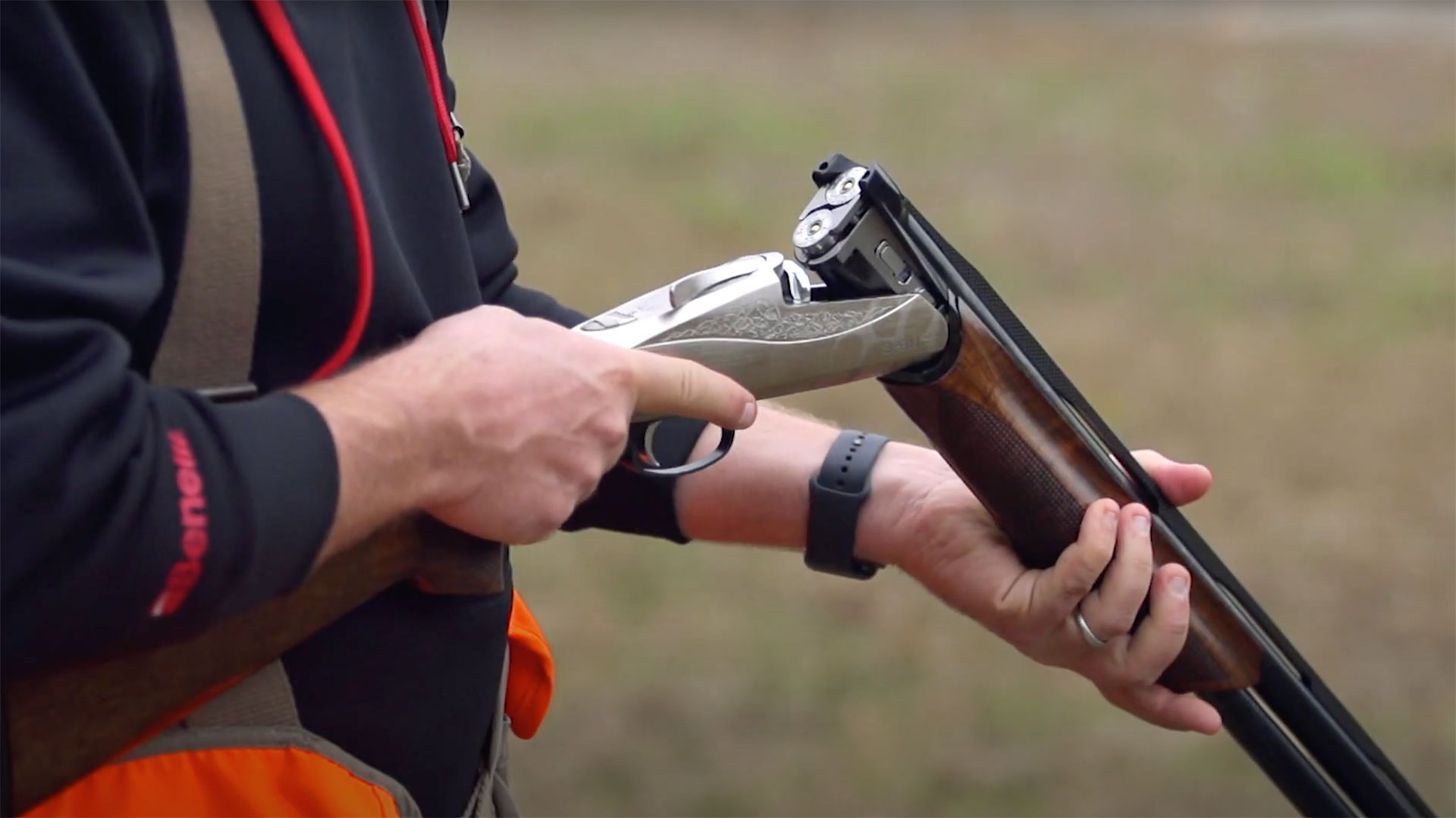 A Benelli 828U over-under shotgun with the action opened.