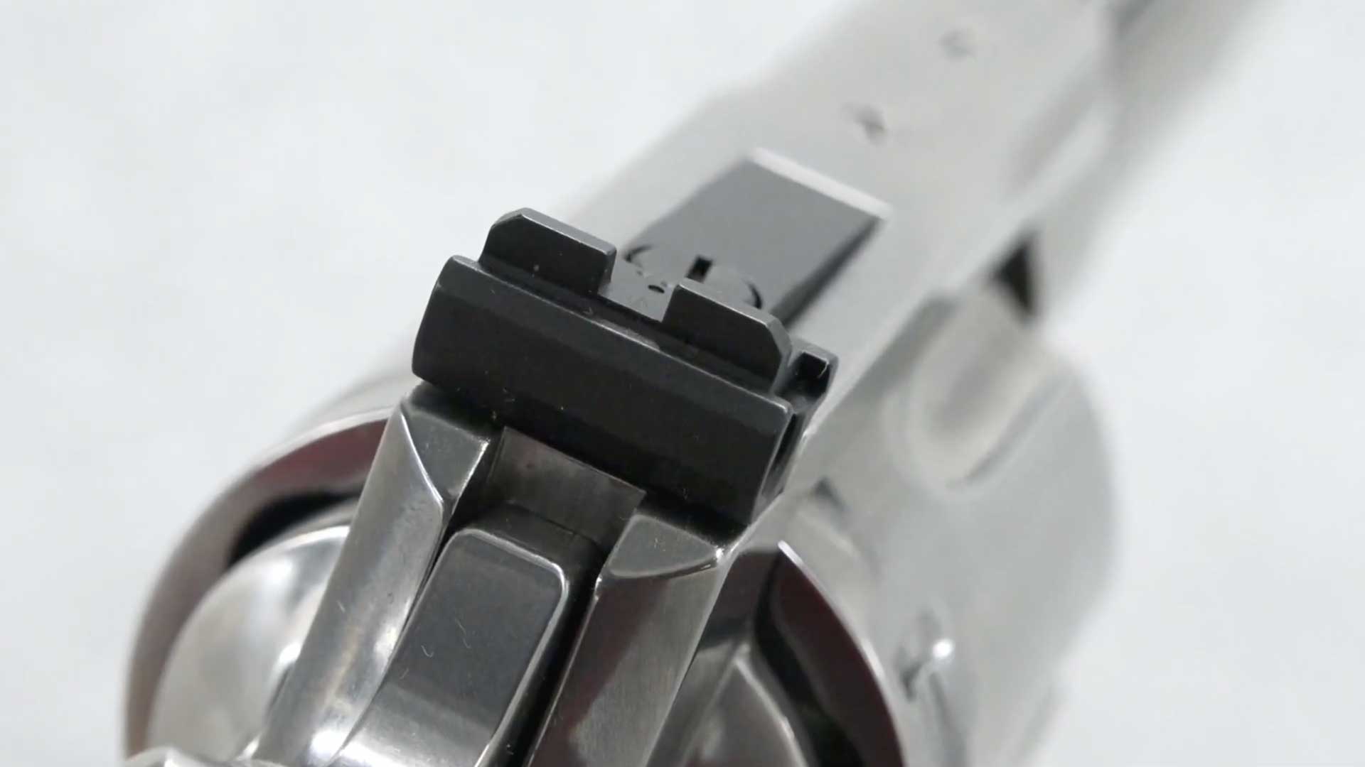 silver stainless metal parts black gun sights revolver
