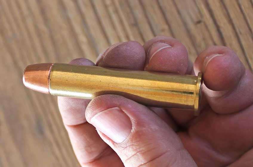 bullet ammo in hand cartridge fingers
