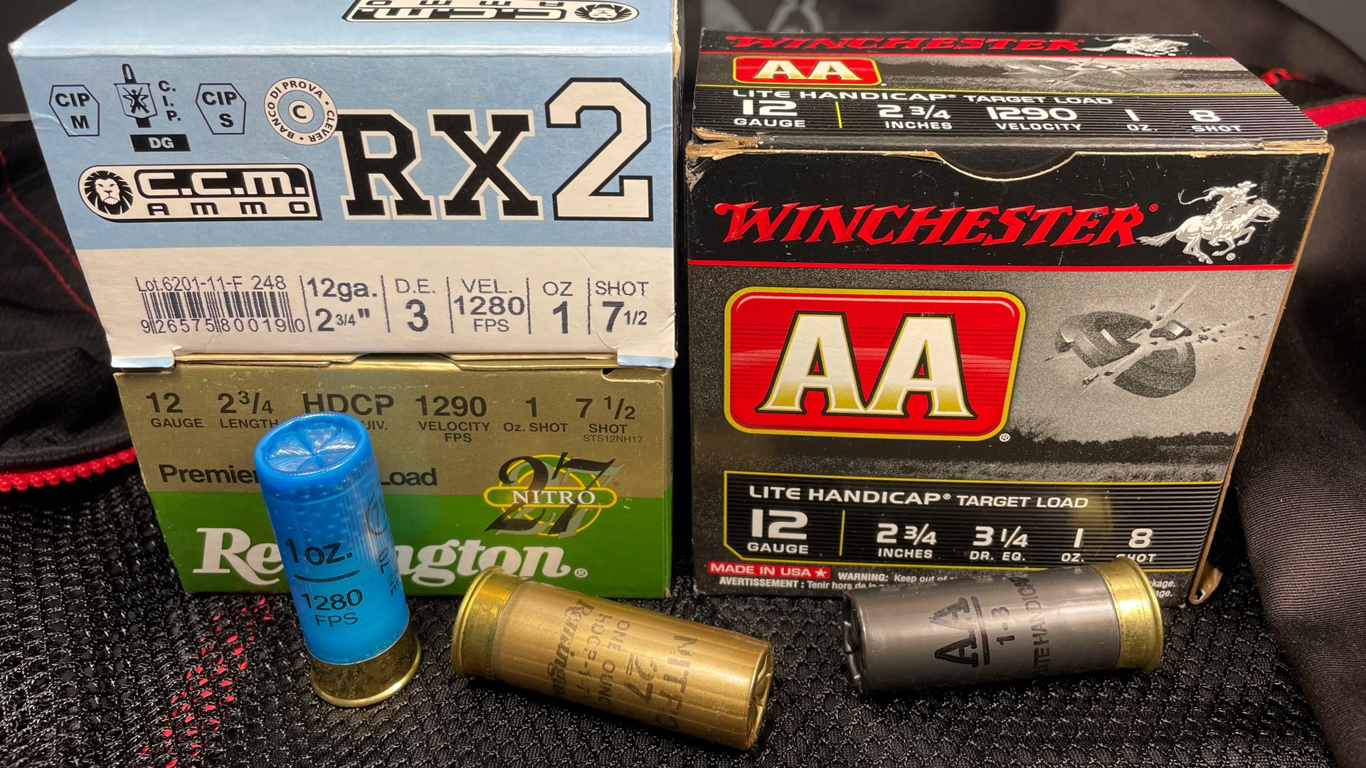 three boxes of 12 gauge shotshell ammunition