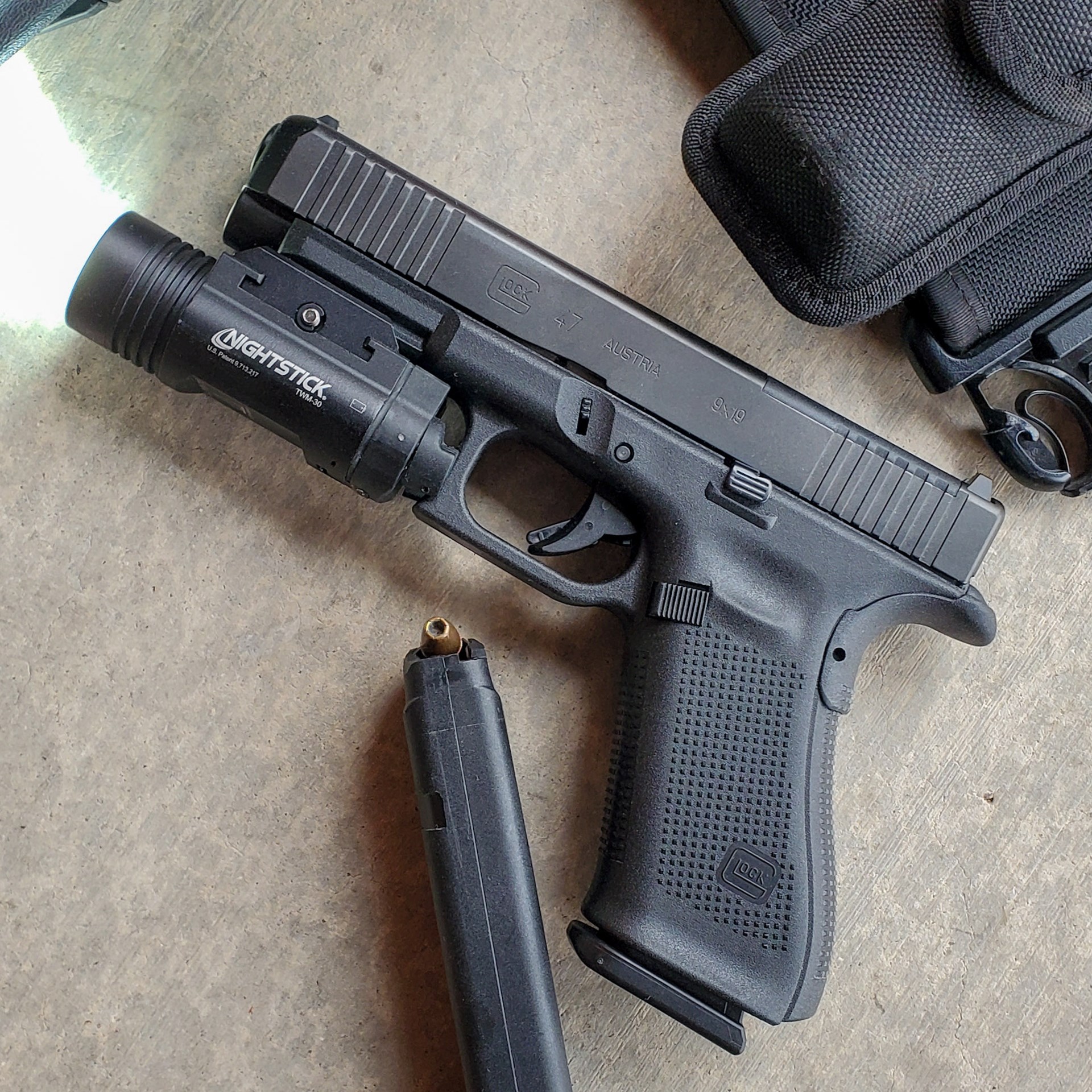 left-side view of Glock G47 pistol with light accessory magazine gun pistol handgun