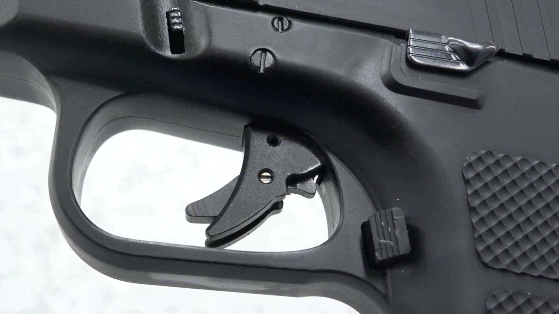 left side black pistol handgun trigger gun parts