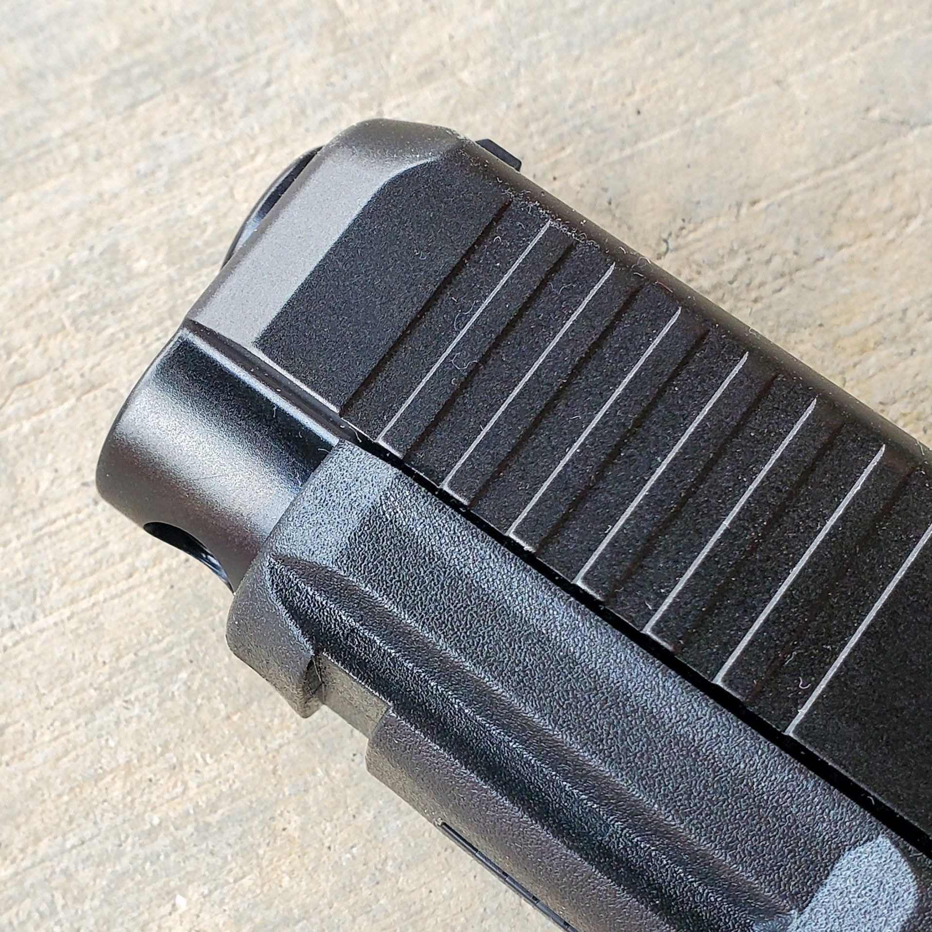 Glock 47 handgun pistol gun muzzle silde serrations accessory rail front bevel holster cut