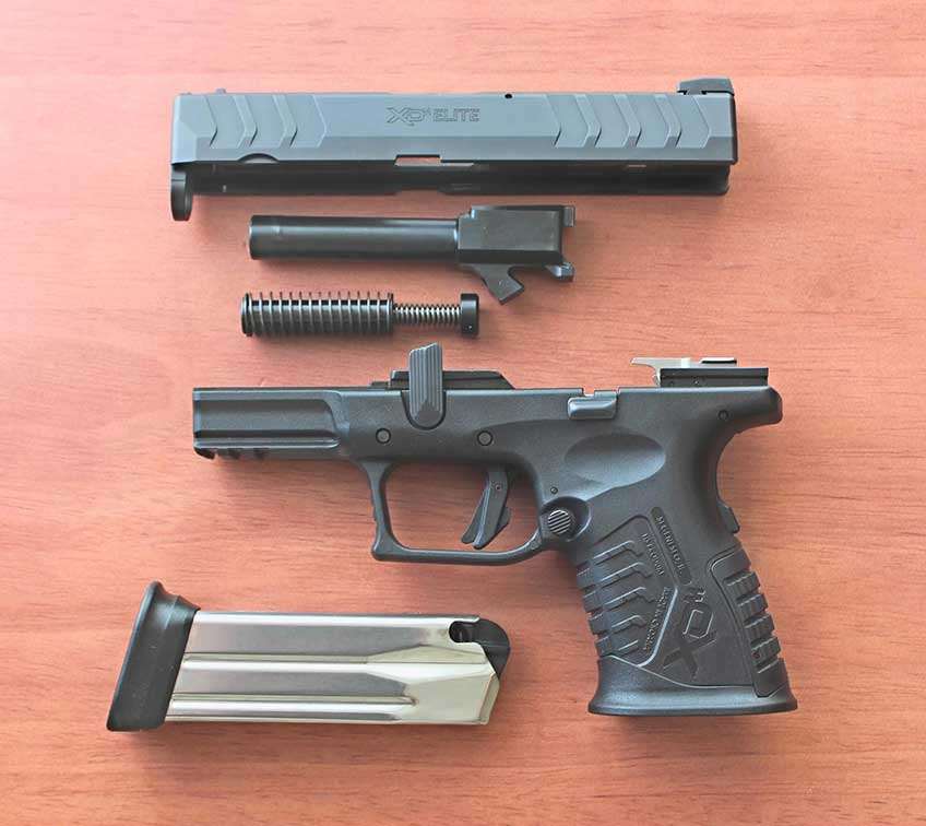 left-side view handgun pistol parts disassembled fieldstripped