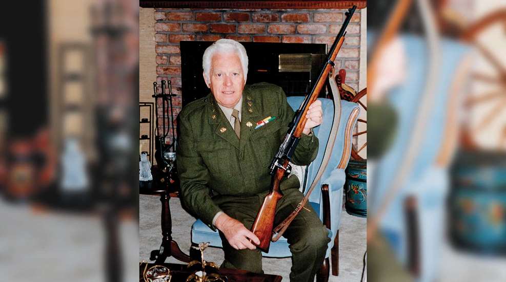 Man soldier uniform indoors house kneeling bolt-action rifle