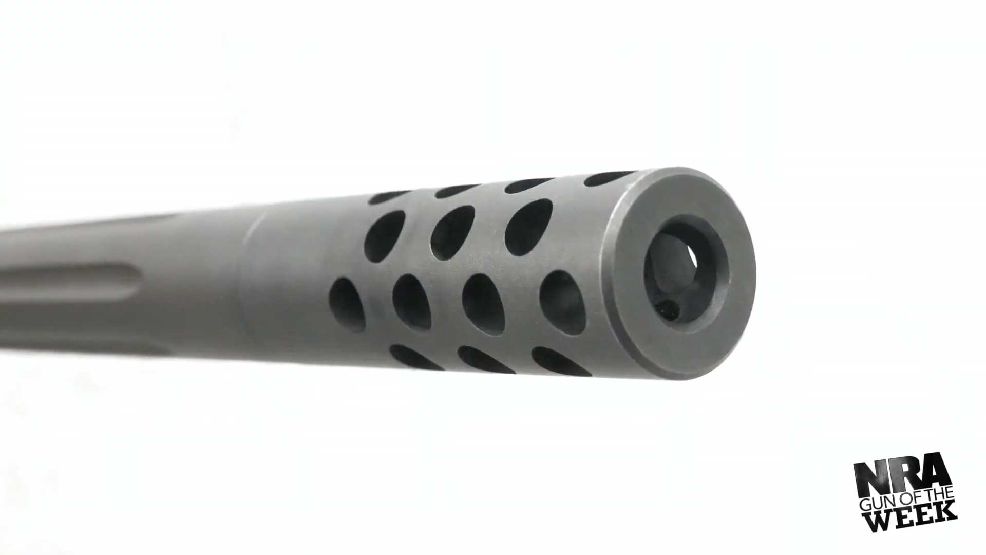 metal steel cylinder rifle barrel gun holes round NRA GUN OF THE WEEK text on image