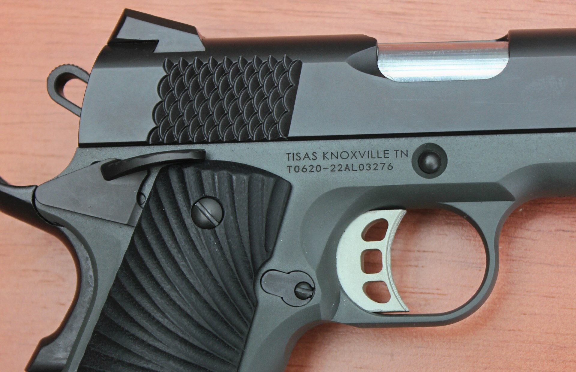 right-side view tisas stingray gun pistol 9mm 1911 handgun focus on aluminum trigger with speed holes lightweight