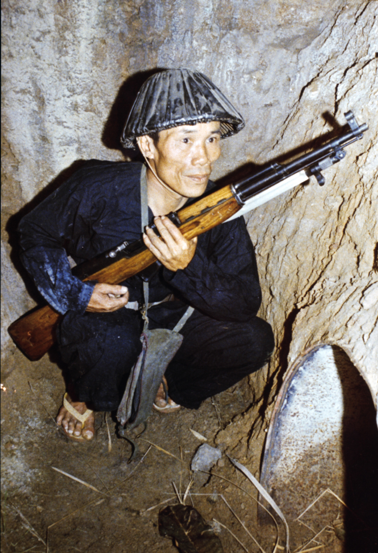 Viet Cong guerilla posing with an SKS carbine (or the Chinese Type 56 semi-automatic carbine copy). The SKS provided another excellent rifle for VC and NVA troops.