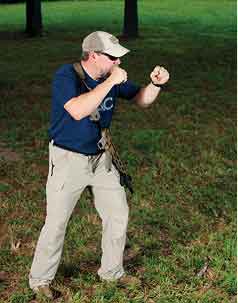 When assuming a standing shooting position, it helps to model your position after a fighter’s stance. This bladed pose presents a small target to opponents, improves balance and stability, and promotes mobility.