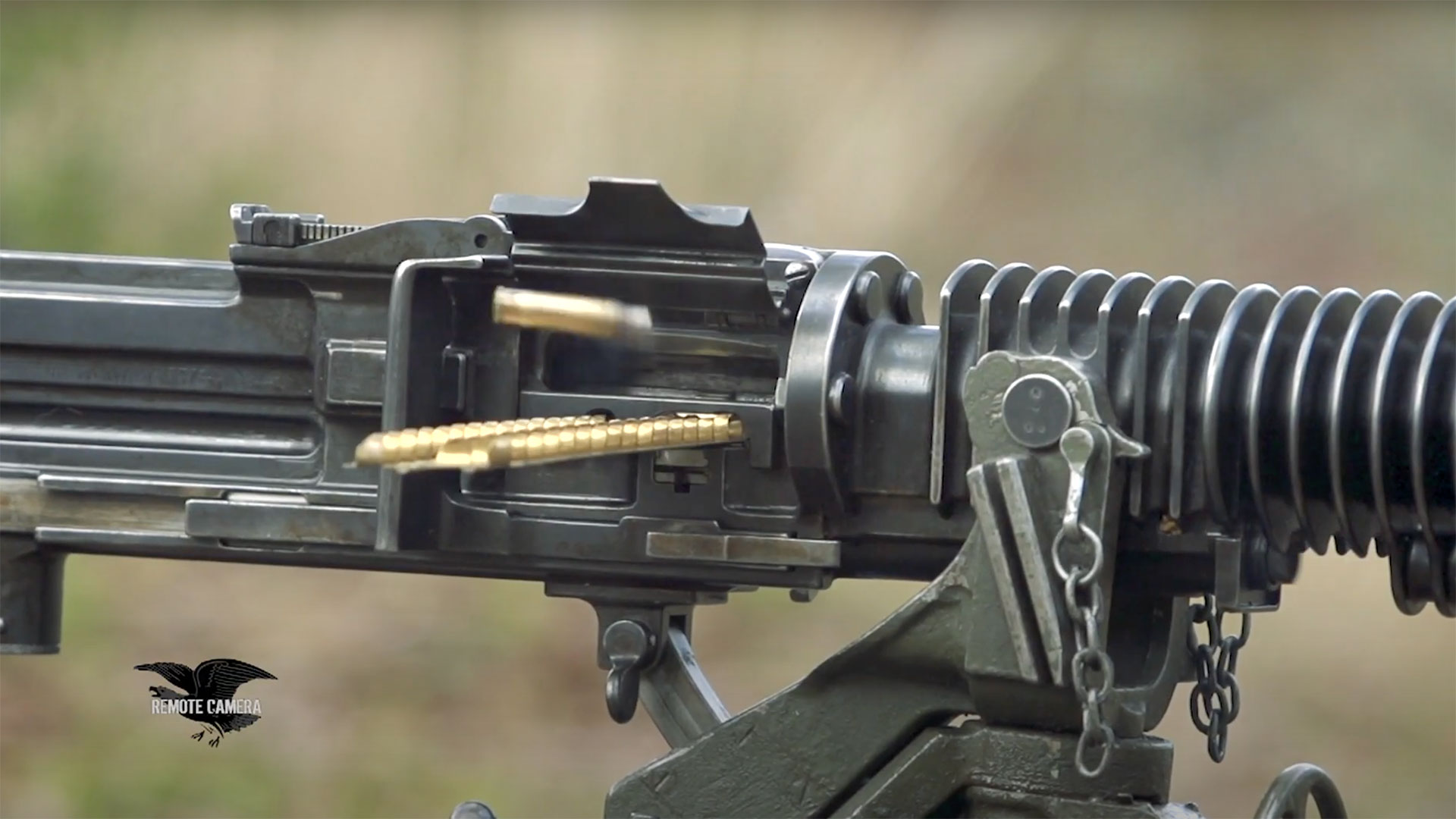 A close-up view of the feed strip being advanced and a cartridge being ejected through the Type 3.