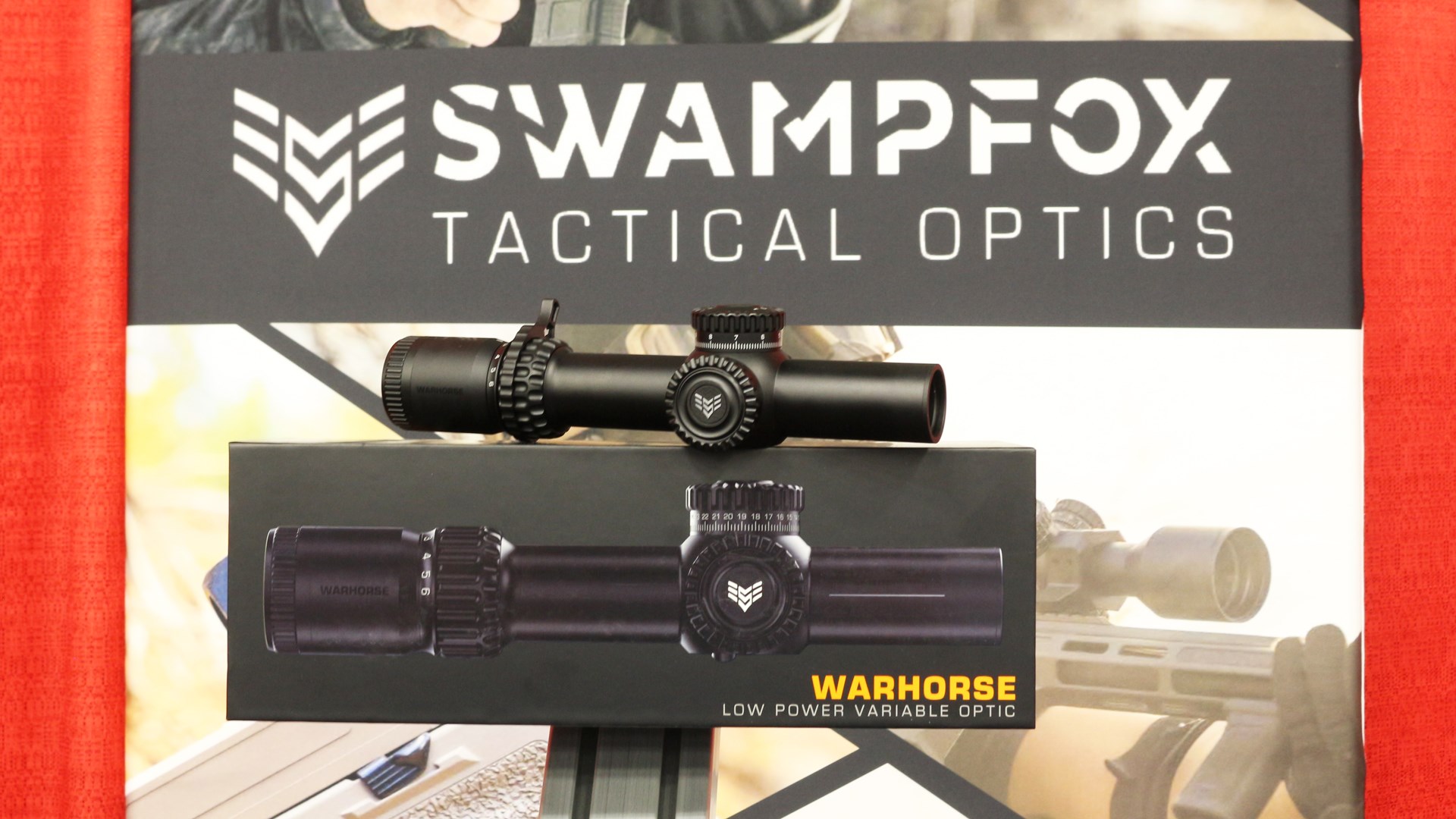 Swampfox tactical optics box with riflescope on top shown on display at nasgw show