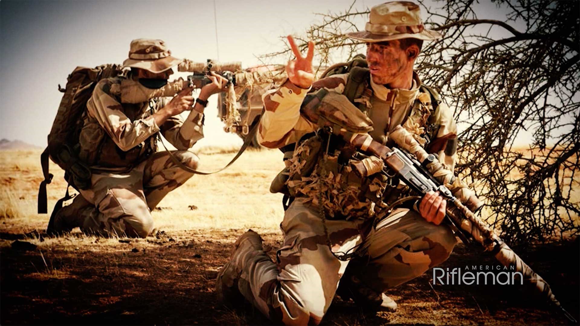 Two camouflaged French soldiers with FRF2 sniper rifles in a desert environment.