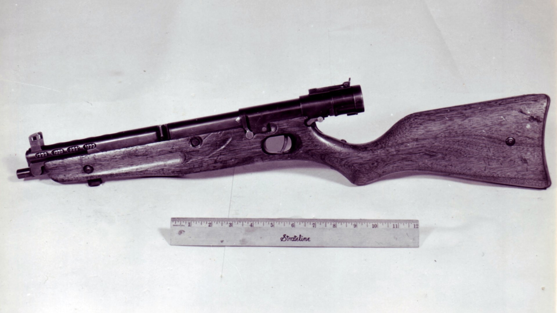 Left-side view of Japanese Type 2 submachine gun shown with ruler for scale