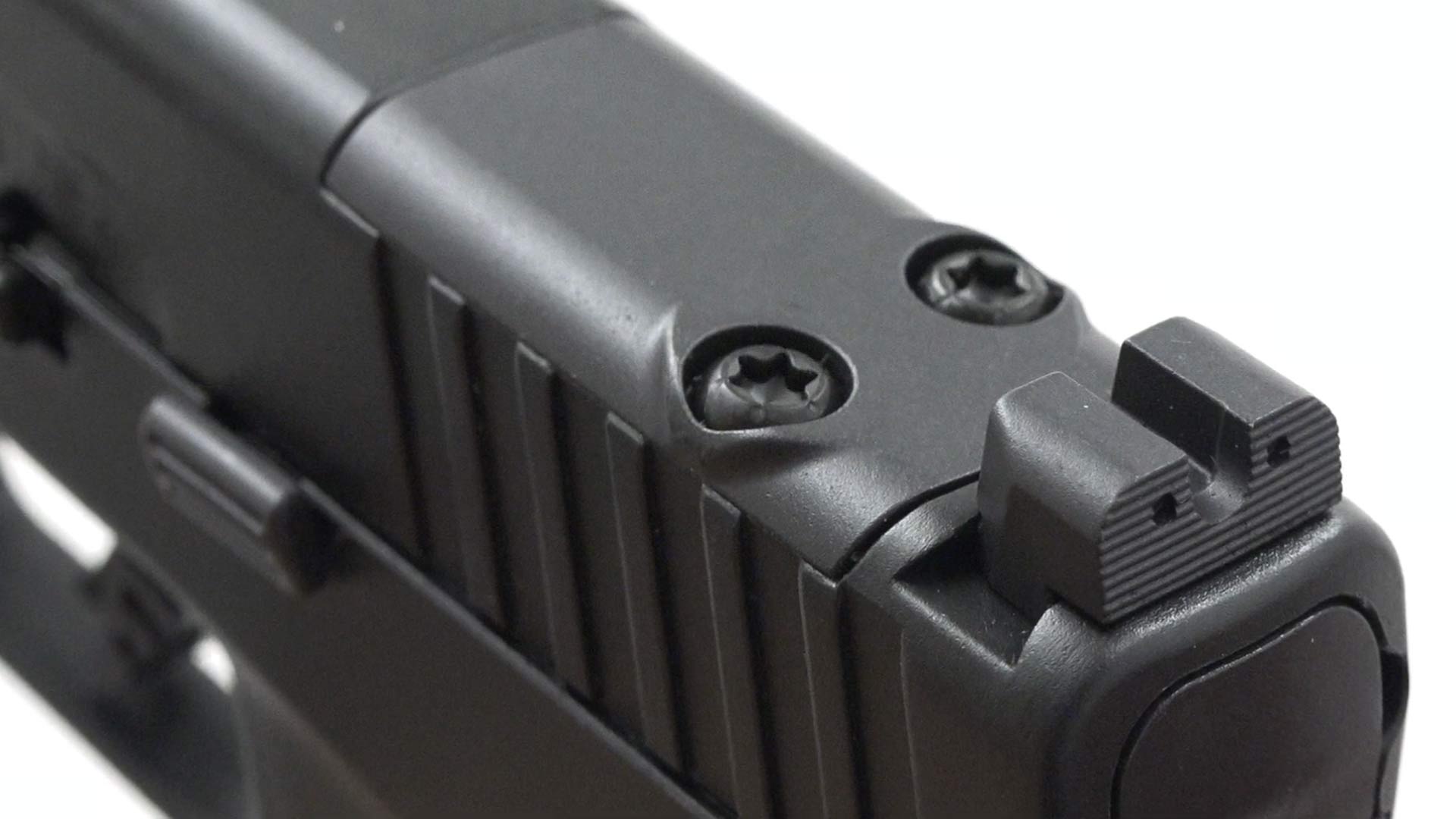 black metal gun parts sights pistol slide plate optic mounting detail closeup