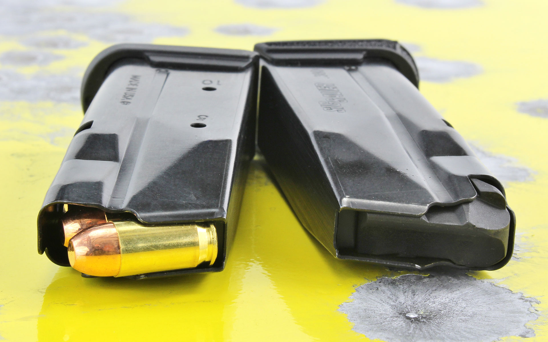 SIG Sauer P365-380 chambered in .380 ACP Black, steel and polymer construction, with a yellow background.