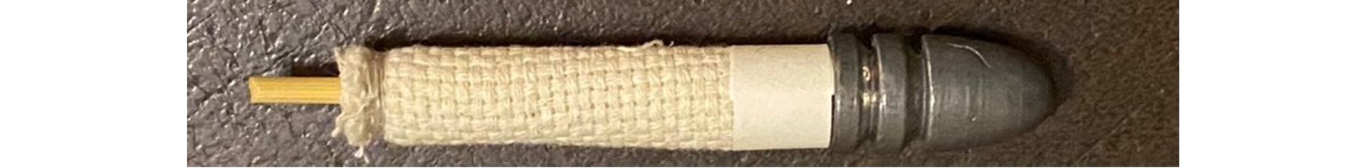left-to-right view of gun cotton cartridge- nitrocellulose propellant cast lead bullet on dowel