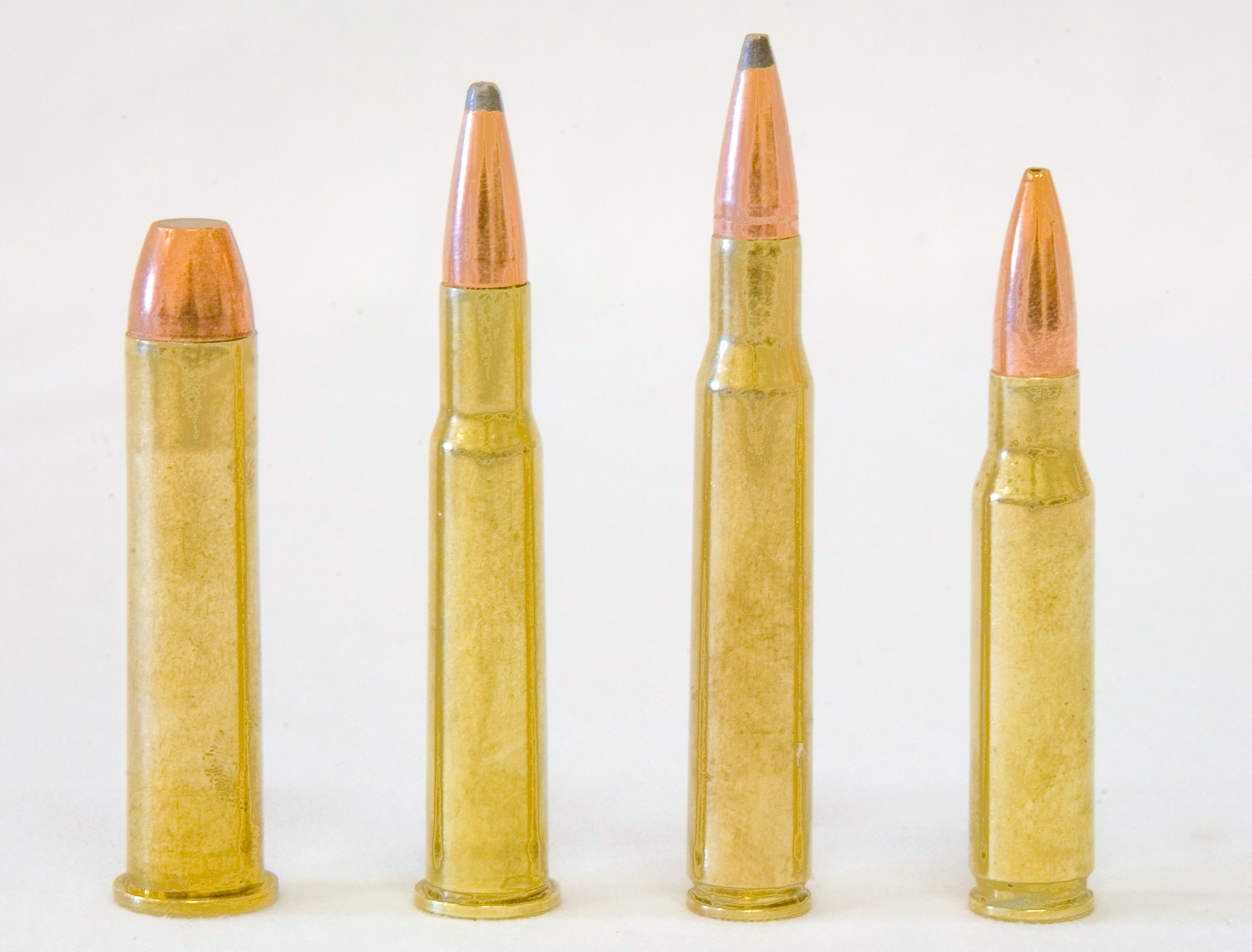Cartridge ammunition bullet comparison row line picket fence arrangement of ammo