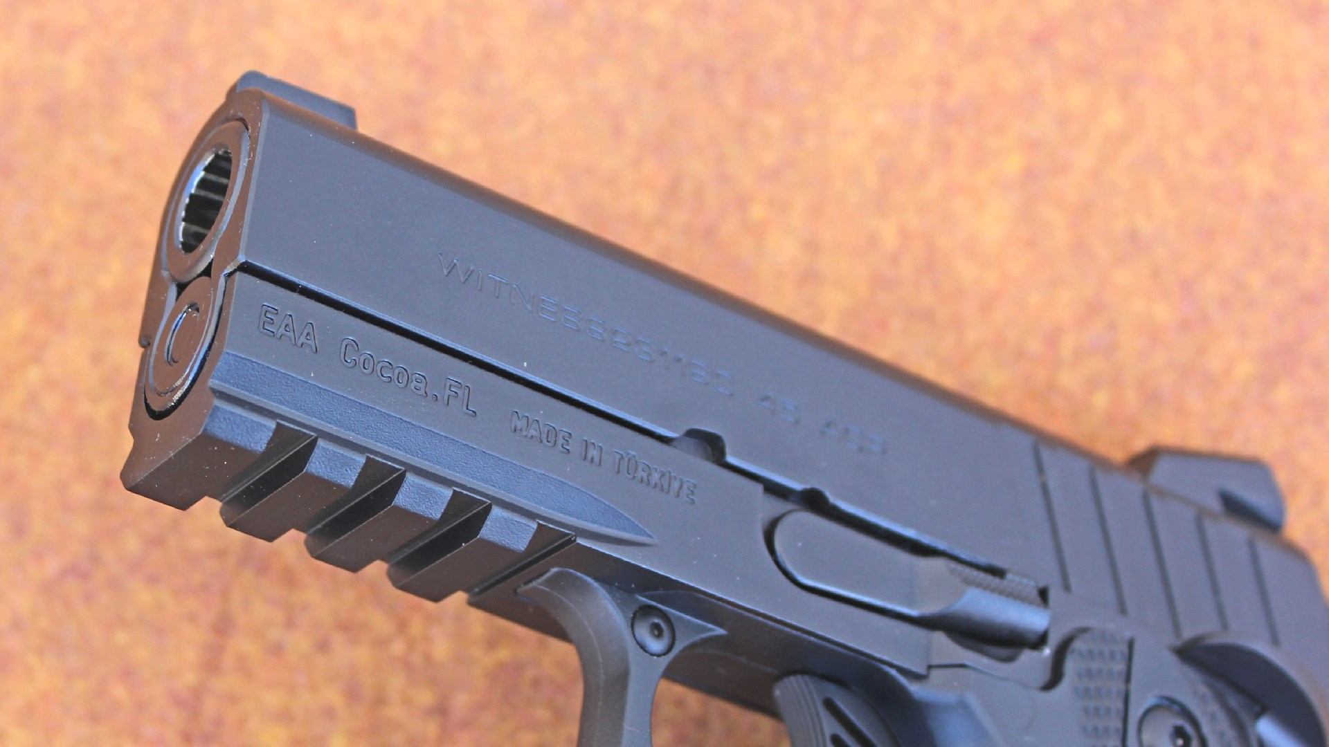 EAA Brat muzzle showing four-slot Picatinny rail for accessories gun pistol barrel