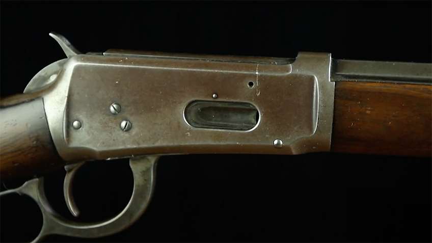 A view of the left side of a Model 1894 reciver, note the loading gate.