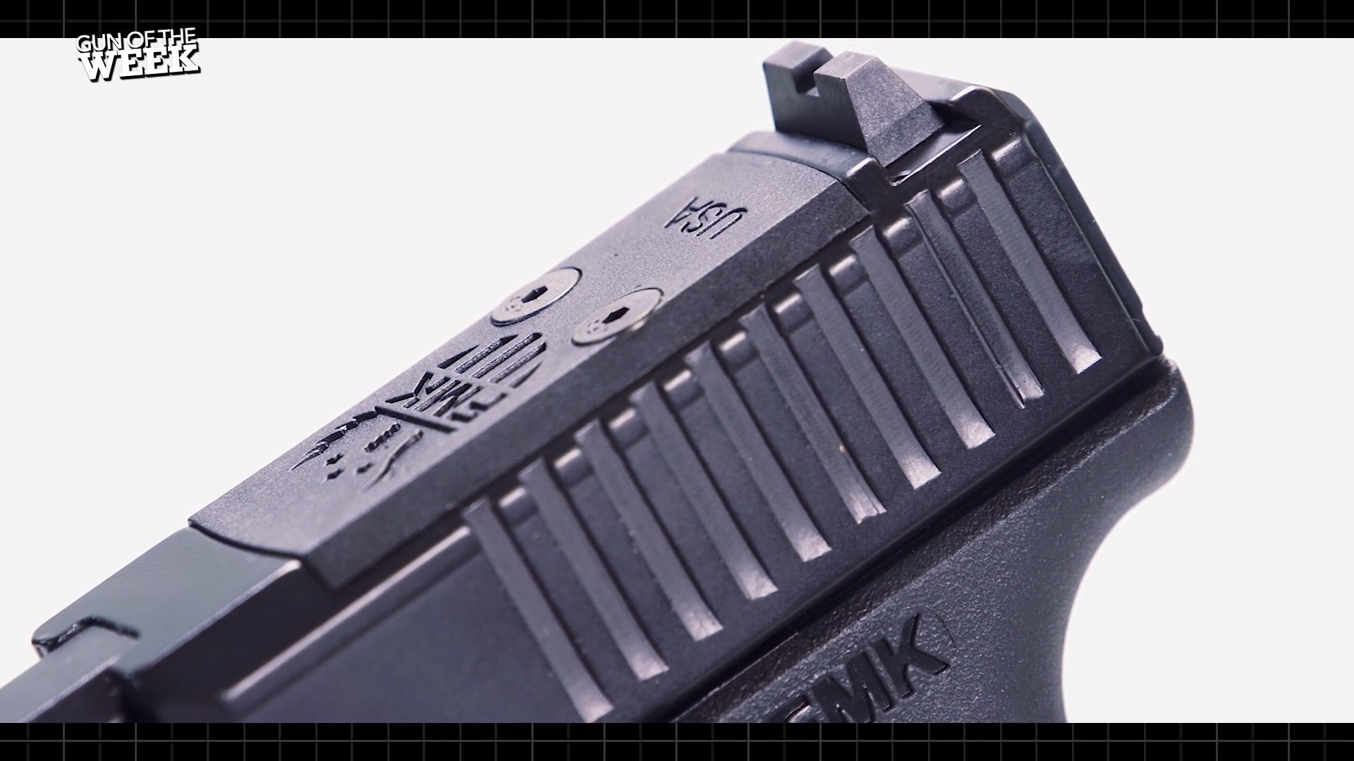 close-up view fmk pistol 9 mm optic cut slide example detail black metal gun parts