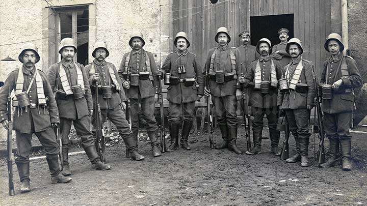 A group of German soldier pose for a picture later in the war. Note that every Gew 98 in the picture has the extended &quot;trench magazine.&quot;