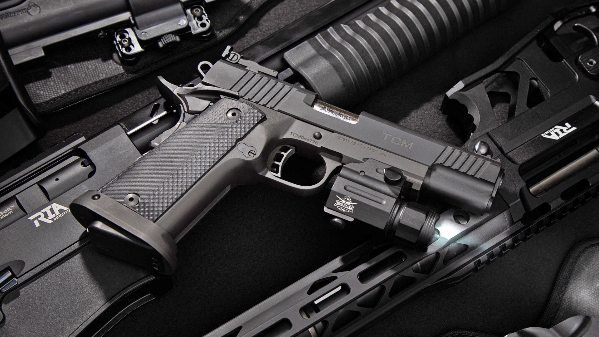 Armscor wide-body 1911 pistol right-side view shown with tactical light and shotguns