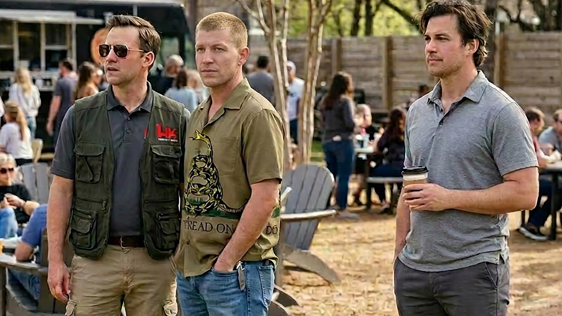 3 men standing outside