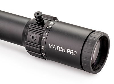 Bushnell Match Pro ED 5-30X 56 mm magnification ring ocular glass tube black finish white background