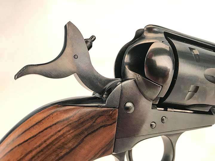 Hammer cocked on a Colt Single Action Army revolver.