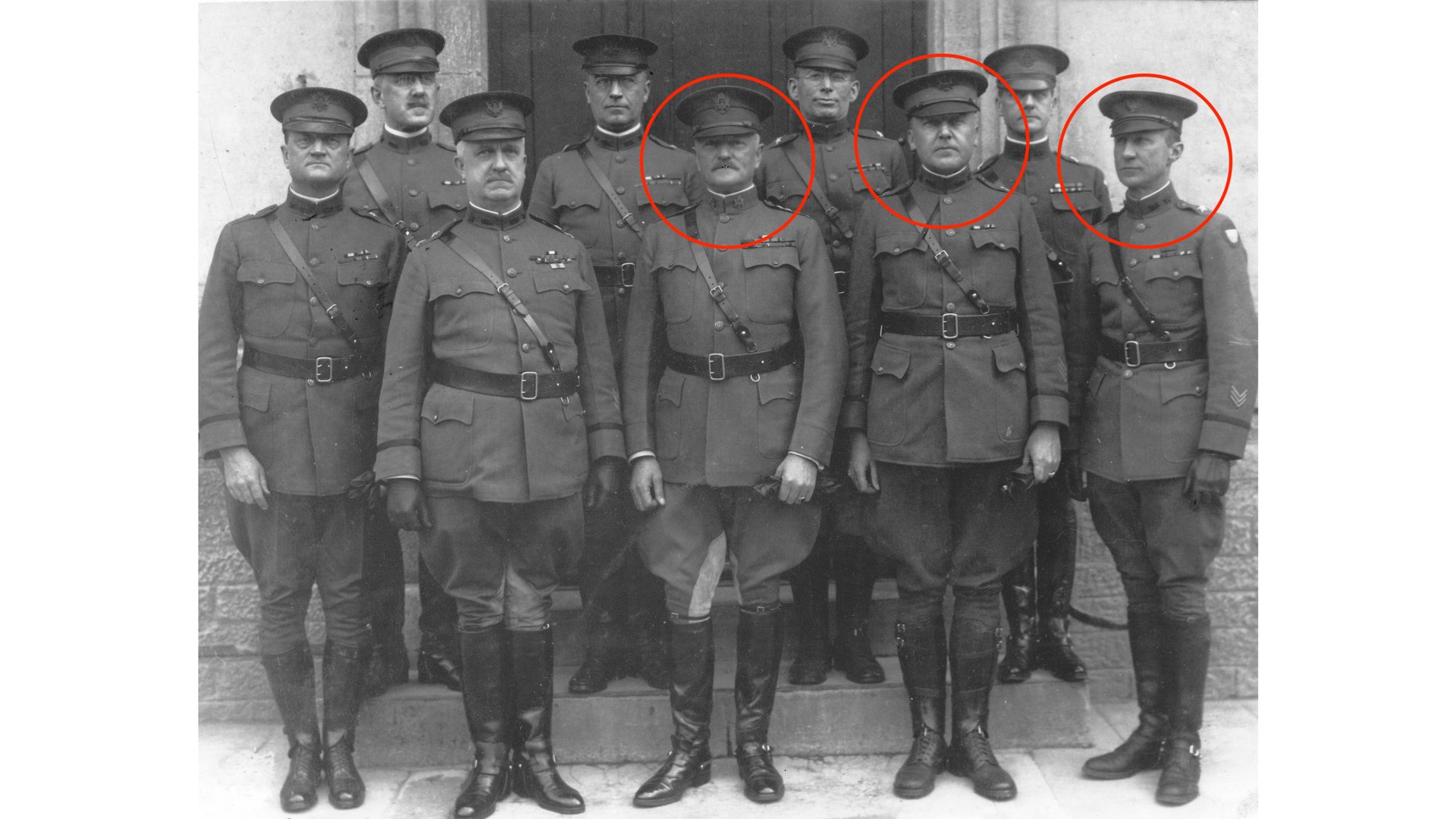The three circled men had significant influence in fielding riot guns with bayonet adapters in combat. Commander of the AEF General Pershing (left) requested the initial adoption of a bayonet capable shotgun. Assistant Chief of Staff for Operations, Brigadier General Fox Conner (center), helped establish the combat trials and supported the adoption of shotguns for trench warfare. Assistant Chief of Staff for Logistics, Brigadier General George Van Horn Moseley (right) worked to get the shotguns in the hands of the Doughboys of combat divisions.