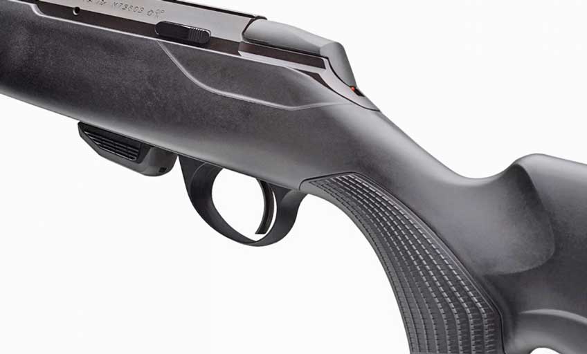 Left side black rifle close-up grip angle white background