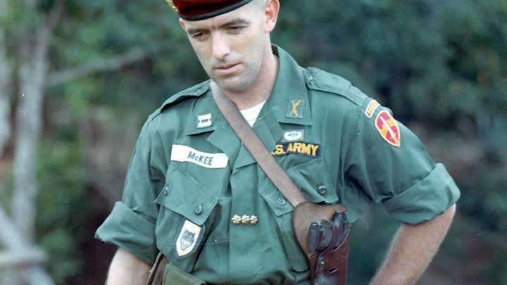 A US Army advisor to the ARVN watches over training exercises in 1965.