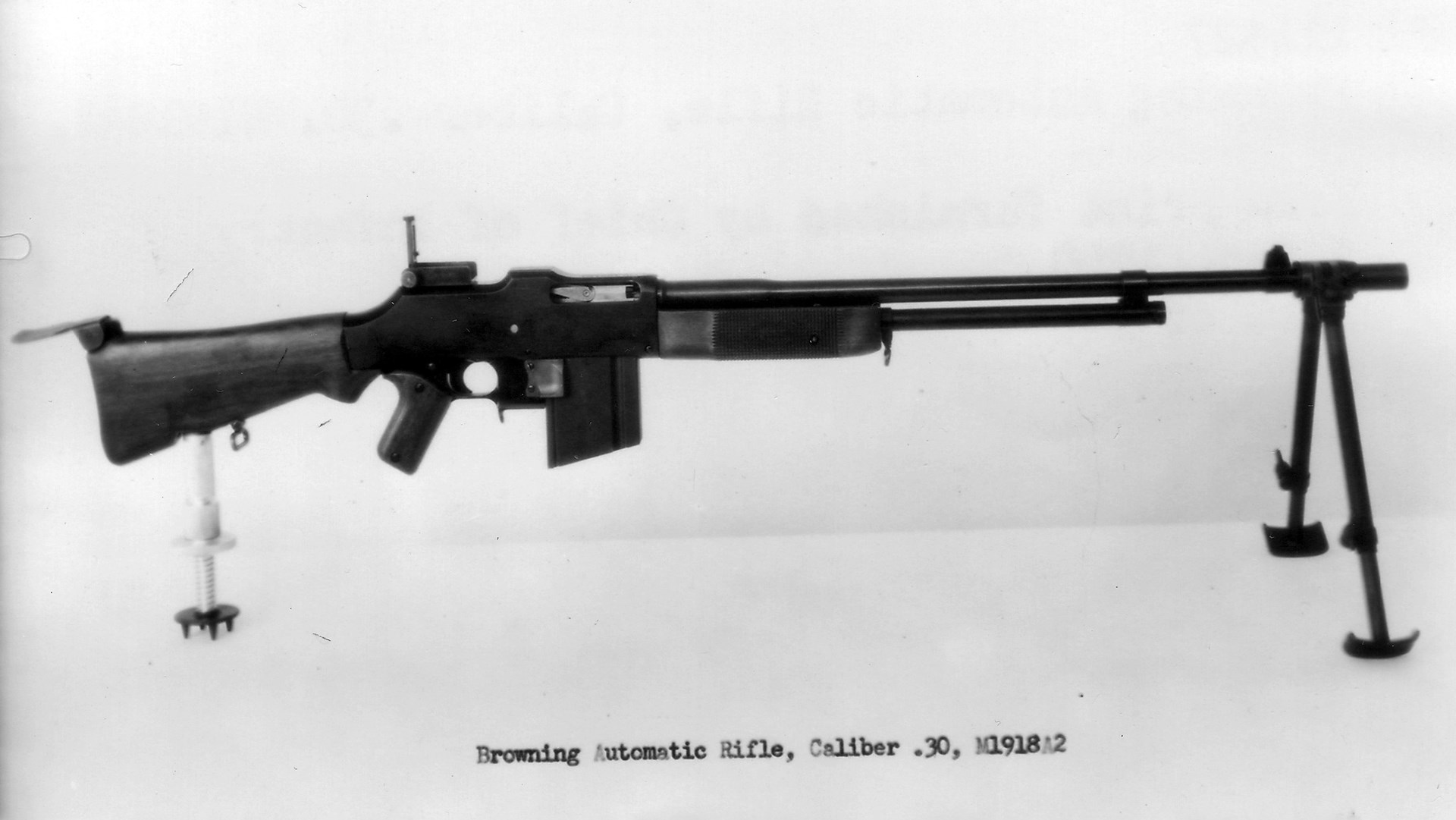 Right-side vew of Browning Automatic Rifle on bipod front and monopod rear