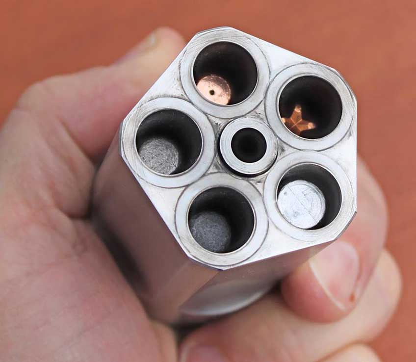 revolver cylinder in hand ammo bullets