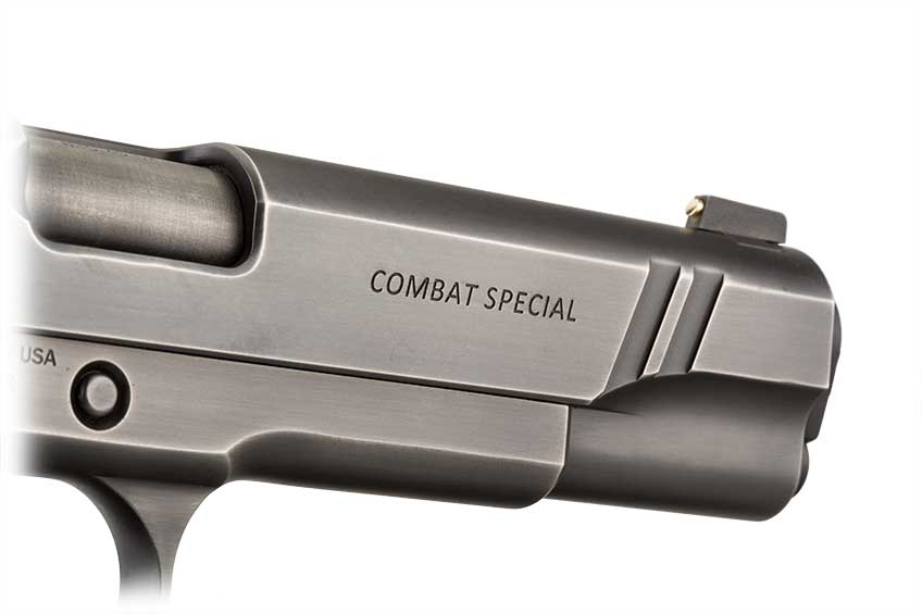 Up-close view of &quot;Combat-Special&quot; stamp on right side of Nighthawk Custom 1911 slide.