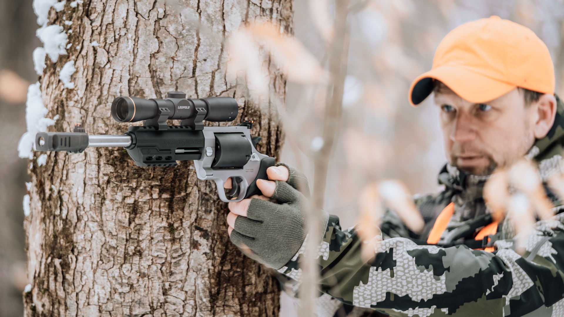 Taurus RH460 revolver outdoors tree snow man hunter shooting target hunting