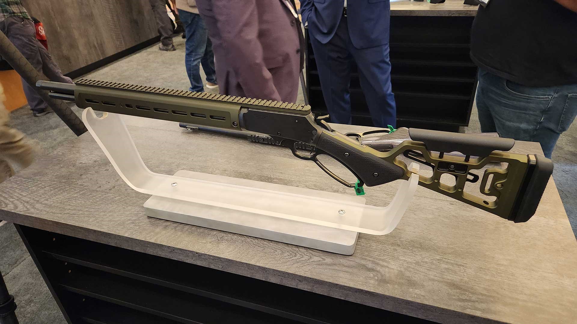 Left side of the Aero Precision Lever Gun displayed on a table at SHOT Show 2024.
