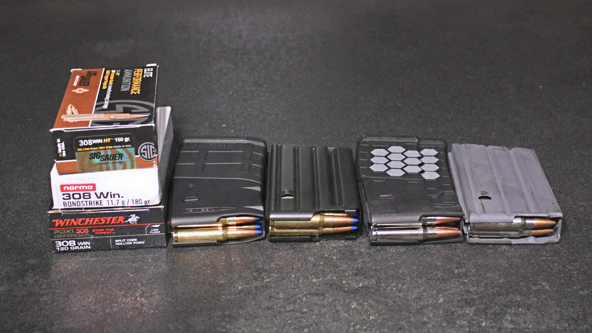 Ammunition boxes and rifle magazines loaded on table