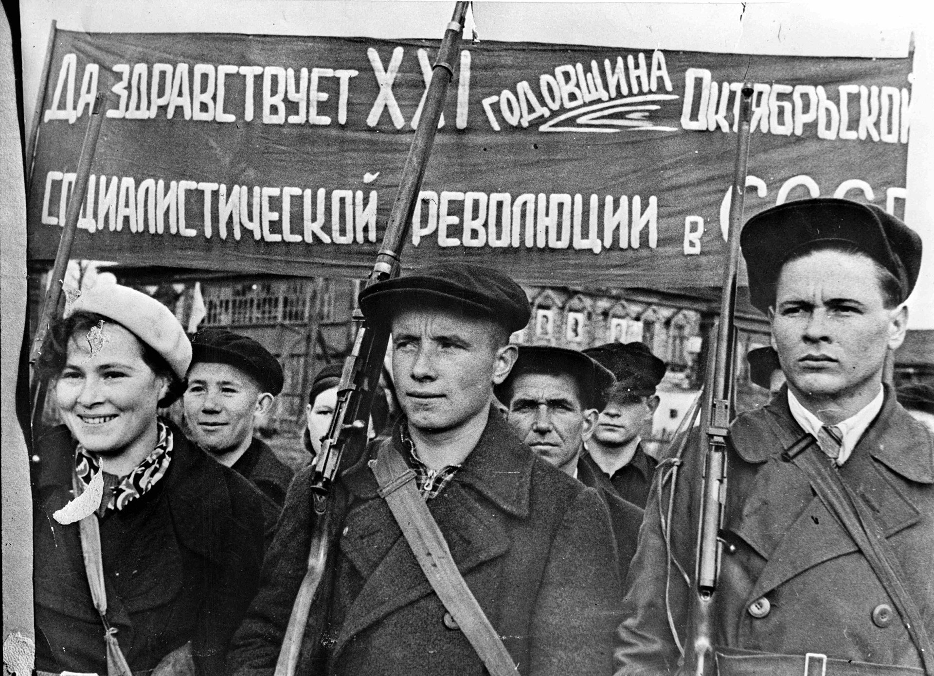 Resistance units sprang up in the country, in the towns and in the factories. Here, a man on the left carries a single-shot, .22-cal. TOZ-8 Cadet Rifle. NARA