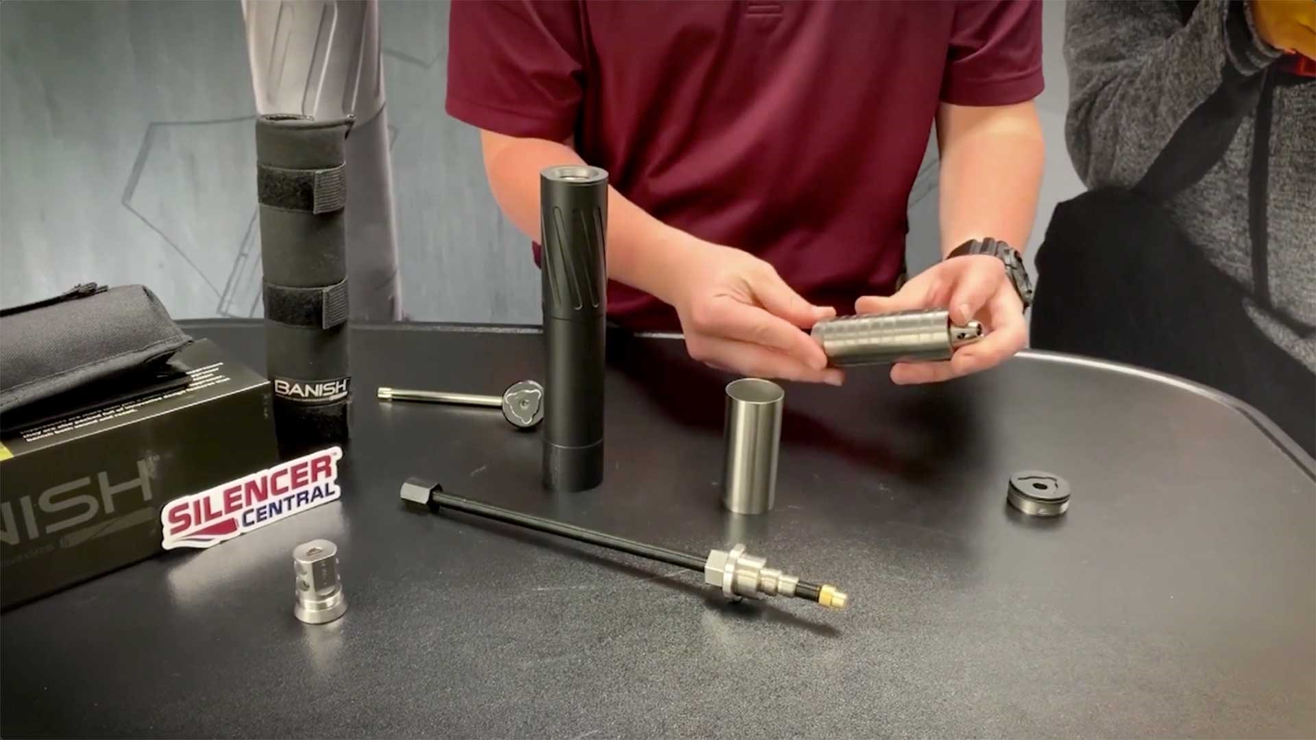 A man holding Silencer Central's Banish suppressor baffles.